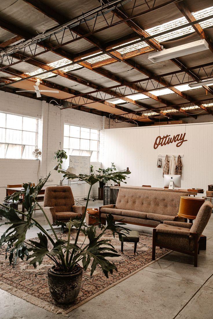 Warehouse lounge with vintage couches and plants